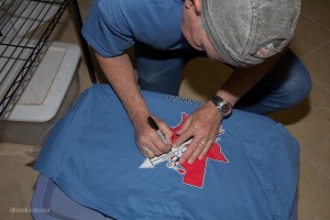 The owner signing my Valhalla shirt.